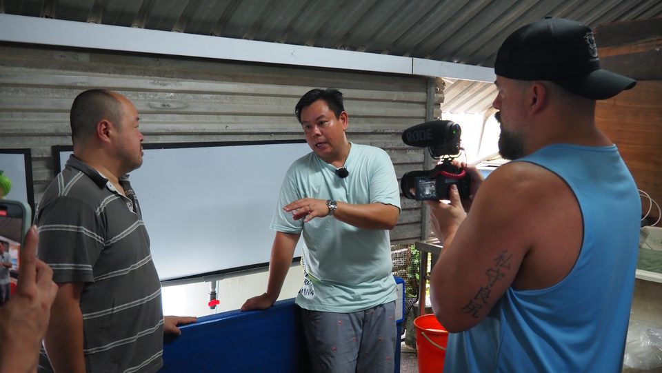 Talking visitors through the fry house.